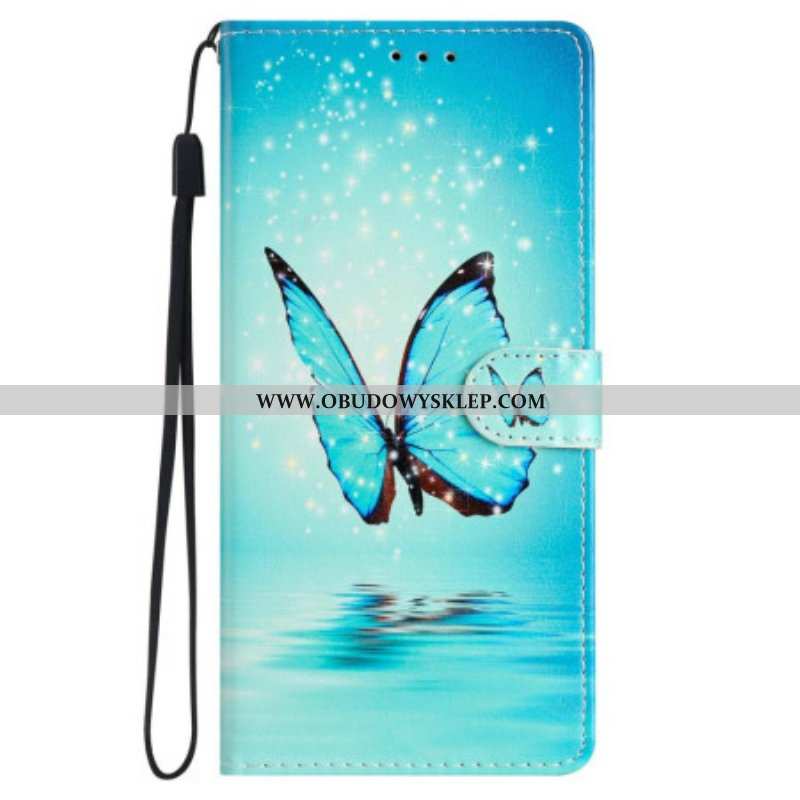 Etui Folio do iPhone 15 z Łańcuch Niebieski Motyl W Locie Z Paskiem